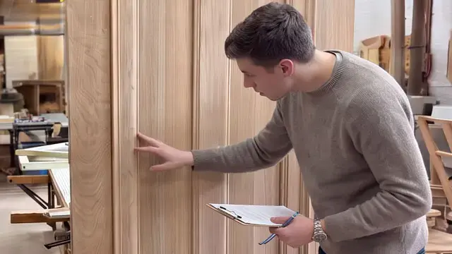 salesman-inspecting-door-human-support-1